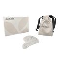 White Jade Gua Sha Tool in a box with a drawstring pouch for skincare therapy and facial massage.