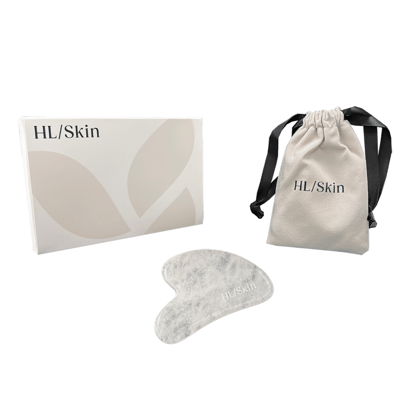 White Jade Gua Sha Tool in a box with a drawstring pouch for skincare therapy and facial massage.